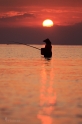 Rybář v západu slunce